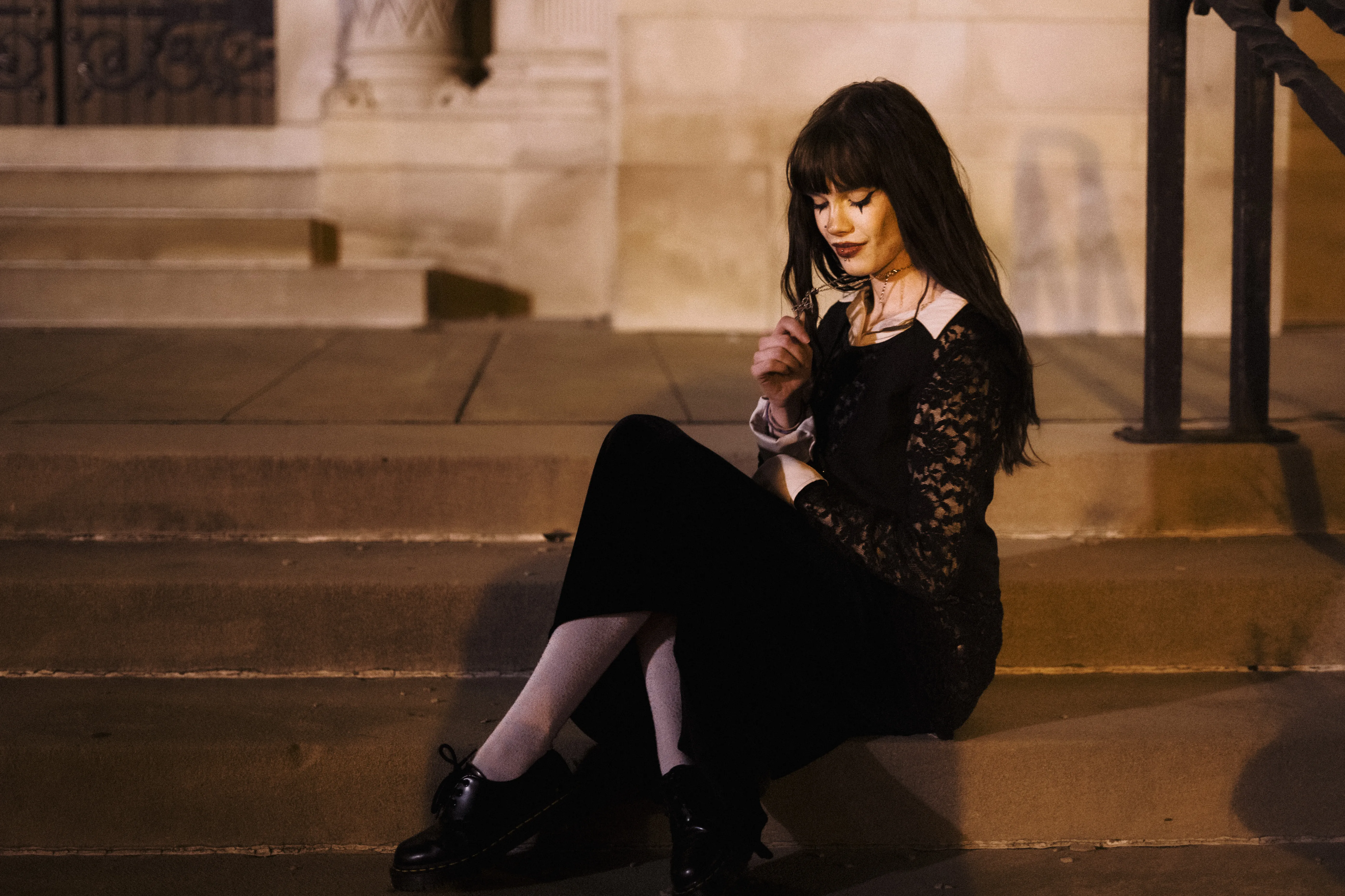 Gothic Girl outside church sitting down